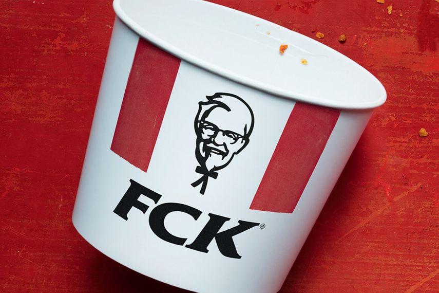 Image from KFC ad showing the iconic chicken bucket with the letters FCK below Colonel Sanders' face.