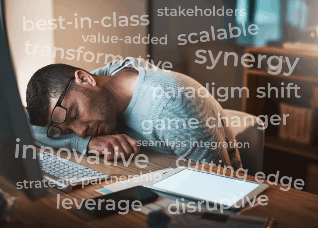 Journalist snoozing at his computer with an ocean of corporate buzzwords swirling above his head