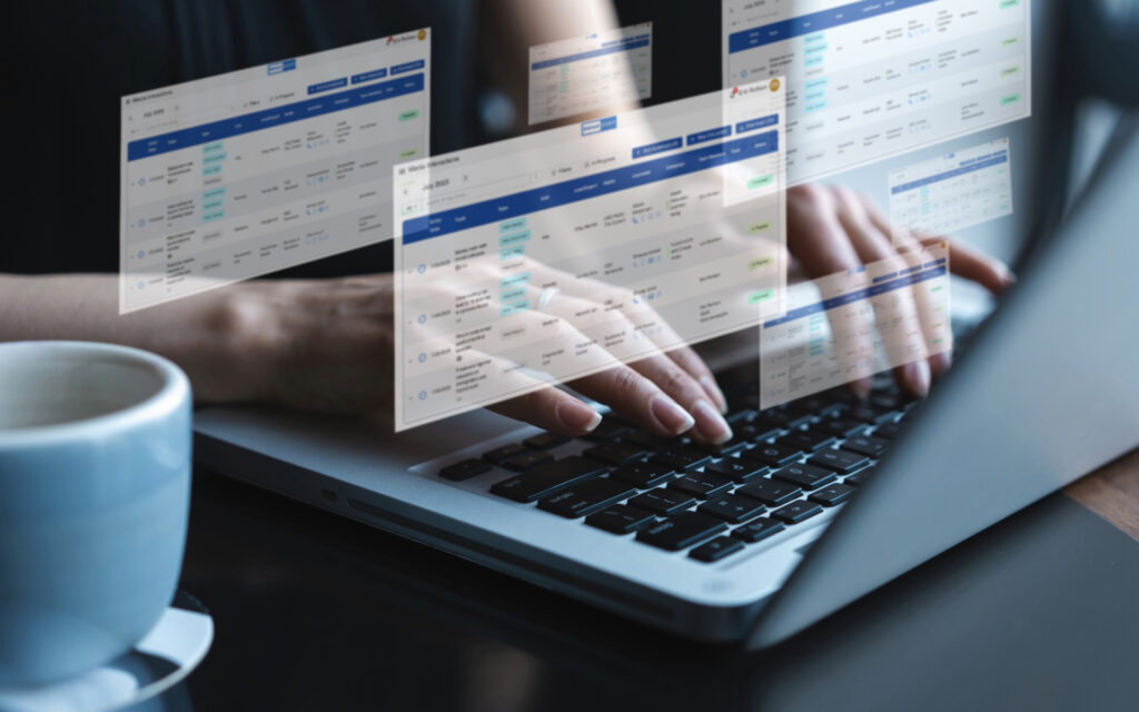 Woman's fingers typing at a laptop while images of the Broadsight interface hover in the air above her keyboard